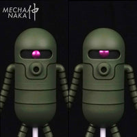 MechaNaka's Gunpla model kit - MS-39 Saku model kit. 
This model kit features two exchangeable eye types, two exchangeable right hands (one with gun and one without gun), and a upright standing base.  Eye comparison.